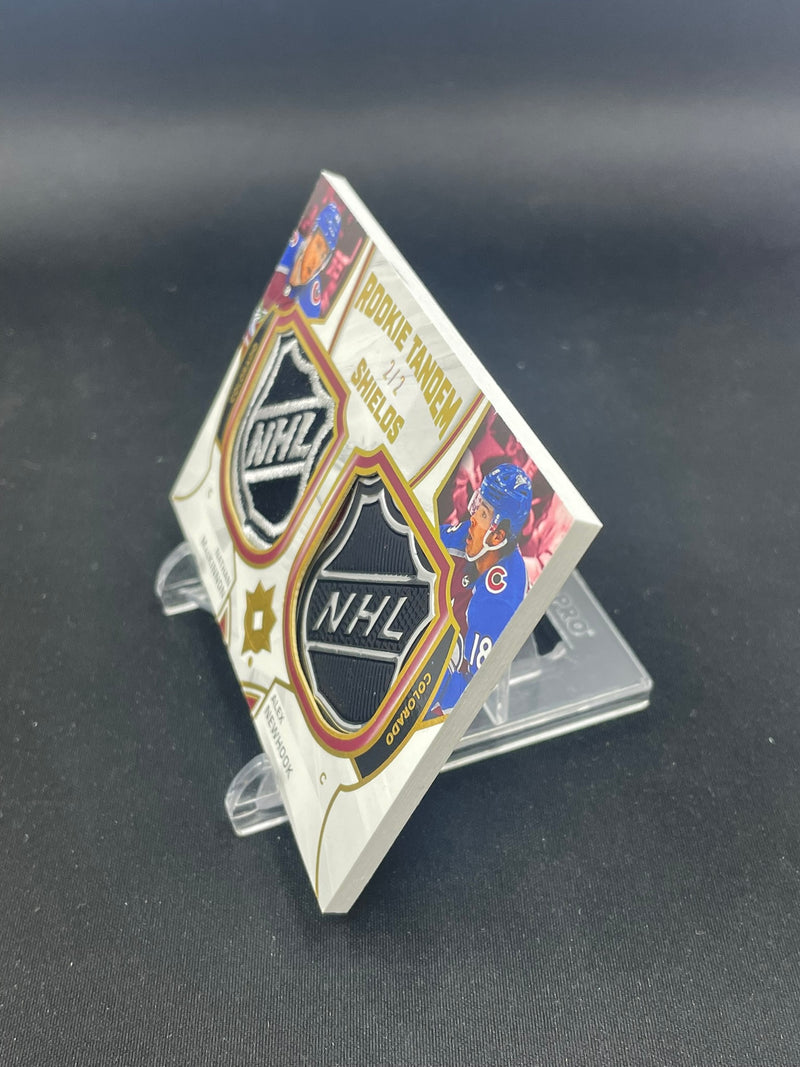 2021 UPPER DECK ULTIMATE - ROOKIE TANDEM SHIELDS - N. MACKINNON / A. NEWHOOK - #RTS-MN - #'D/2 - DUAL RELIC
