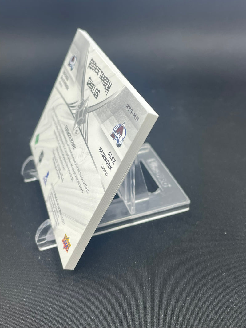 2021 UPPER DECK ULTIMATE - ROOKIE TANDEM SHIELDS - N. MACKINNON / A. NEWHOOK - #RTS-MN - #'D/2 - DUAL RELIC