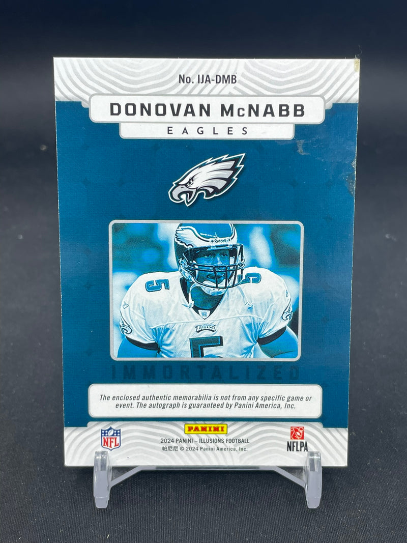 2024 PANINI ILLUSIONS - EMERALD - IMMORTALIZED - D. MCNABB - #IJA-DMB - #'D/10 - RELIC - AUTOGRAPH