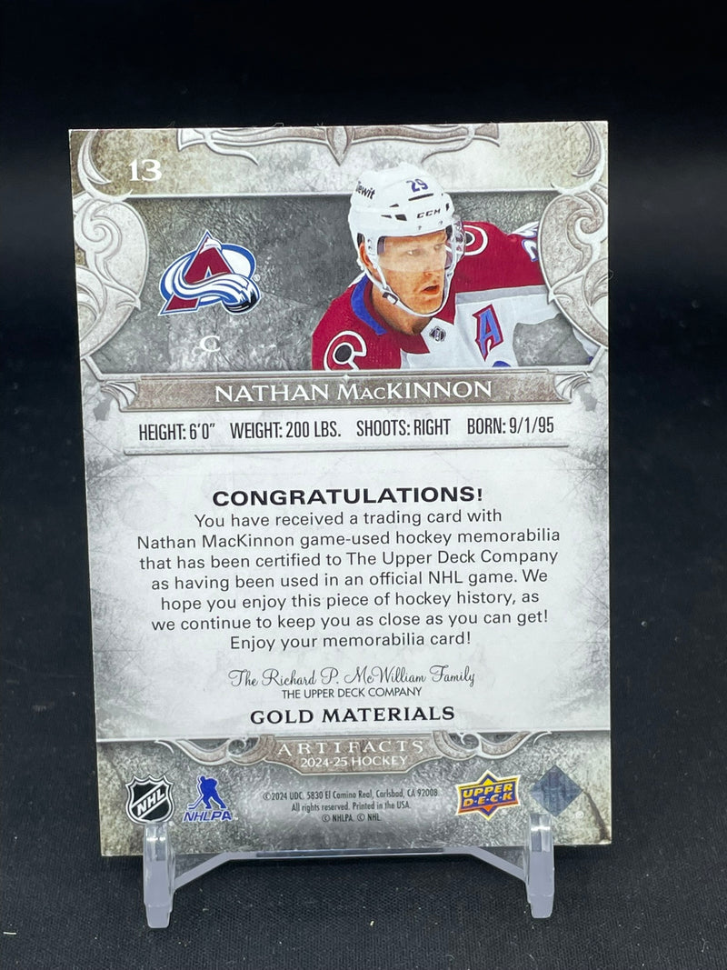 2024 UPPER DECK ARTIFACTS - GOLD MATERIALS - N. MACKINNON - #13 - #'D/299 - DUAL RELIC