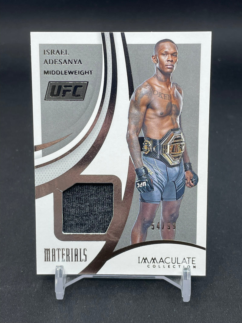 2021 PANINI IMMACULATE - MATERIALS - I. ADESANYA - #M-IAD - #'D/99 - RELIC