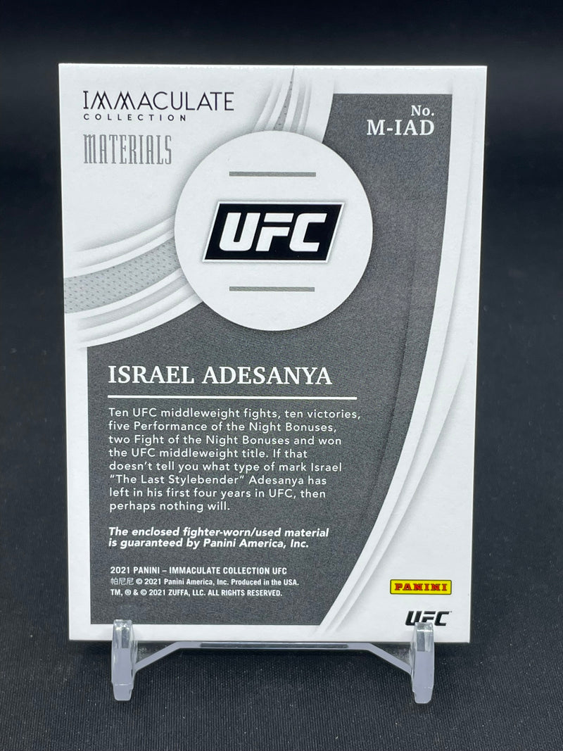 2021 PANINI IMMACULATE - MATERIALS - I. ADESANYA - #M-IAD - #'D/99 - RELIC