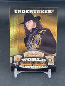 2010 TOPPS WWE - WORLD CHAMPIONSHIP MATERIAL - UNDERTAKER -