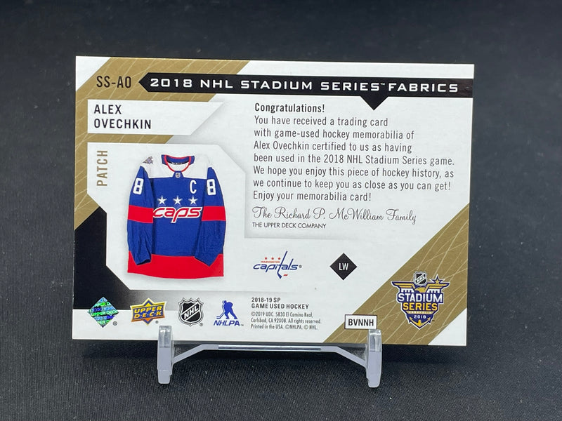 2018 UPPER DECK SP GAME USED - GOLD - STADIUM SERIES FABRICS - A. OVECHKIN - #SS-AO - #'D/35 - RELIC