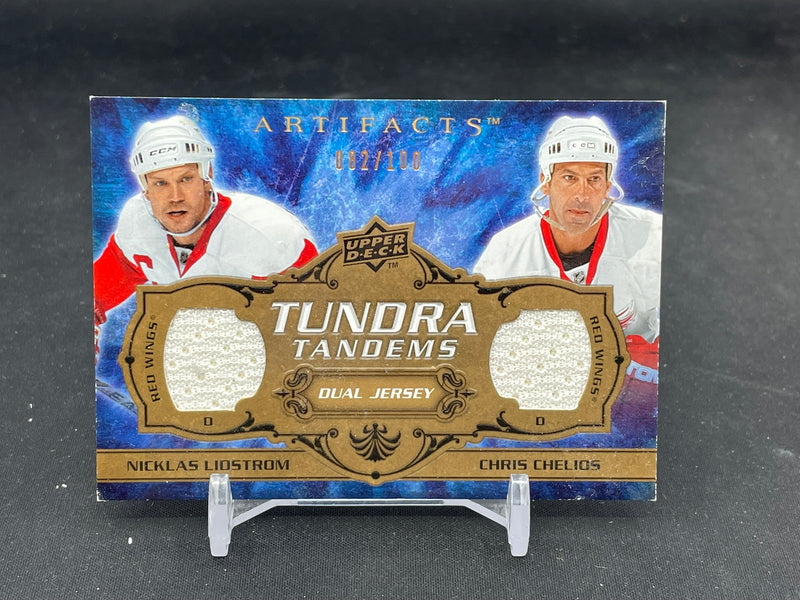 2008 UPPER DECK ARTIFACTS - TUNDRA TANDEMS - N. LIDSTROM / C. CHELIOS - #TT-CL - #'D/100 - DUAL RELIC