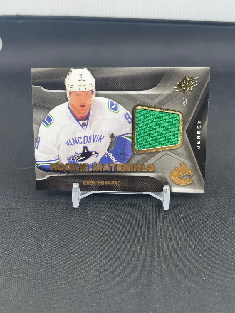 2011 UPPER DECK SPX - ROOKIE MATERIALS - C. HODGSON -